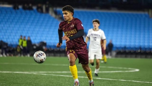 Midwestern State drives to the goal in DII men's soccer. 